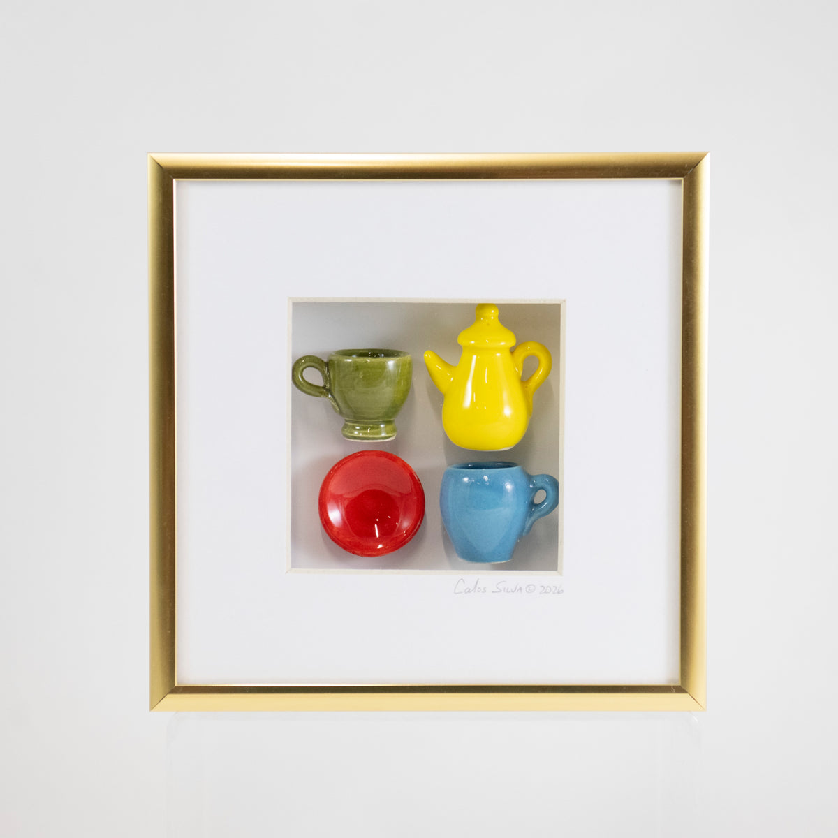 6x6 Shadowbox with a Yellow Teapot and Red Plate in a Gold Frame
