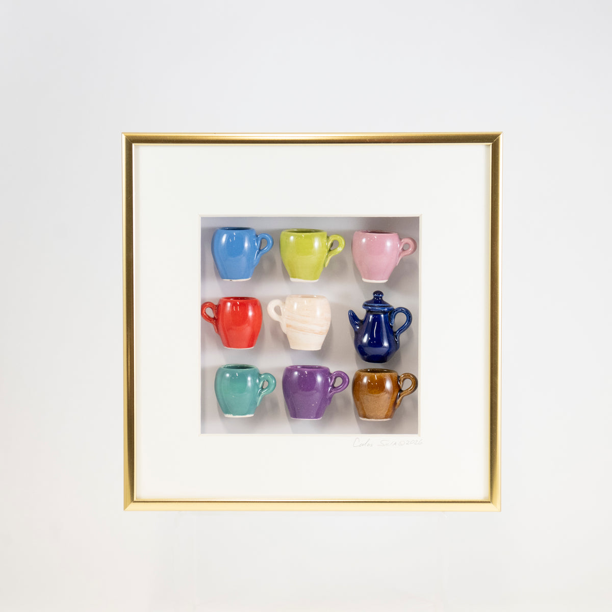8x8 Shadowbox with a Blue Teapot and Blue, Cream, and Brown Mugs in a Gold Frame