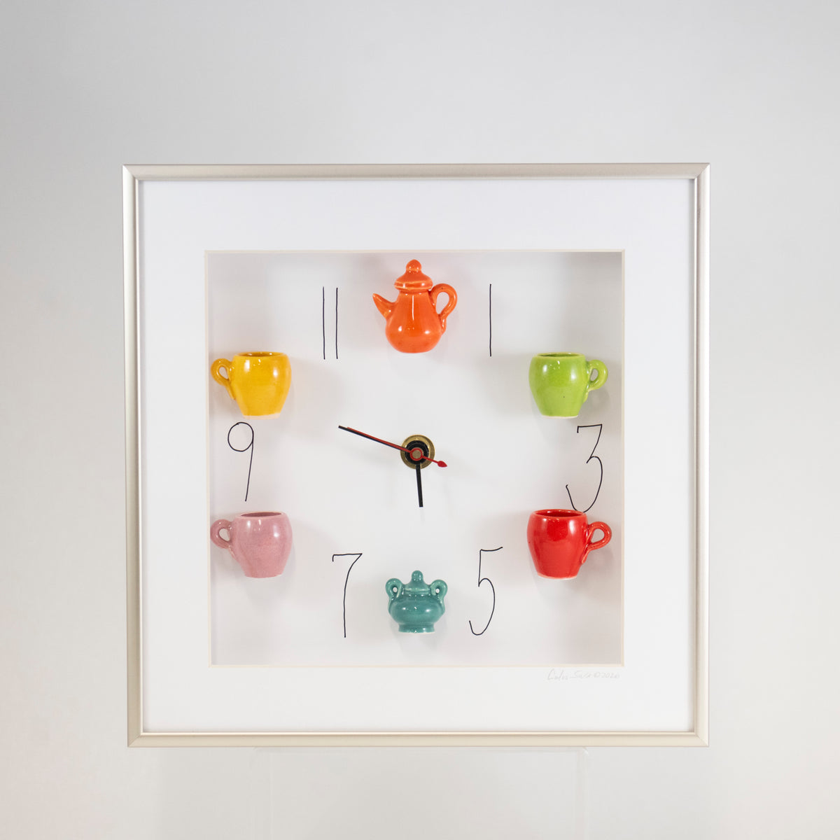 10x10 Clock with a Orange Teapot and Teal Sugar Jar in a Silver Frame