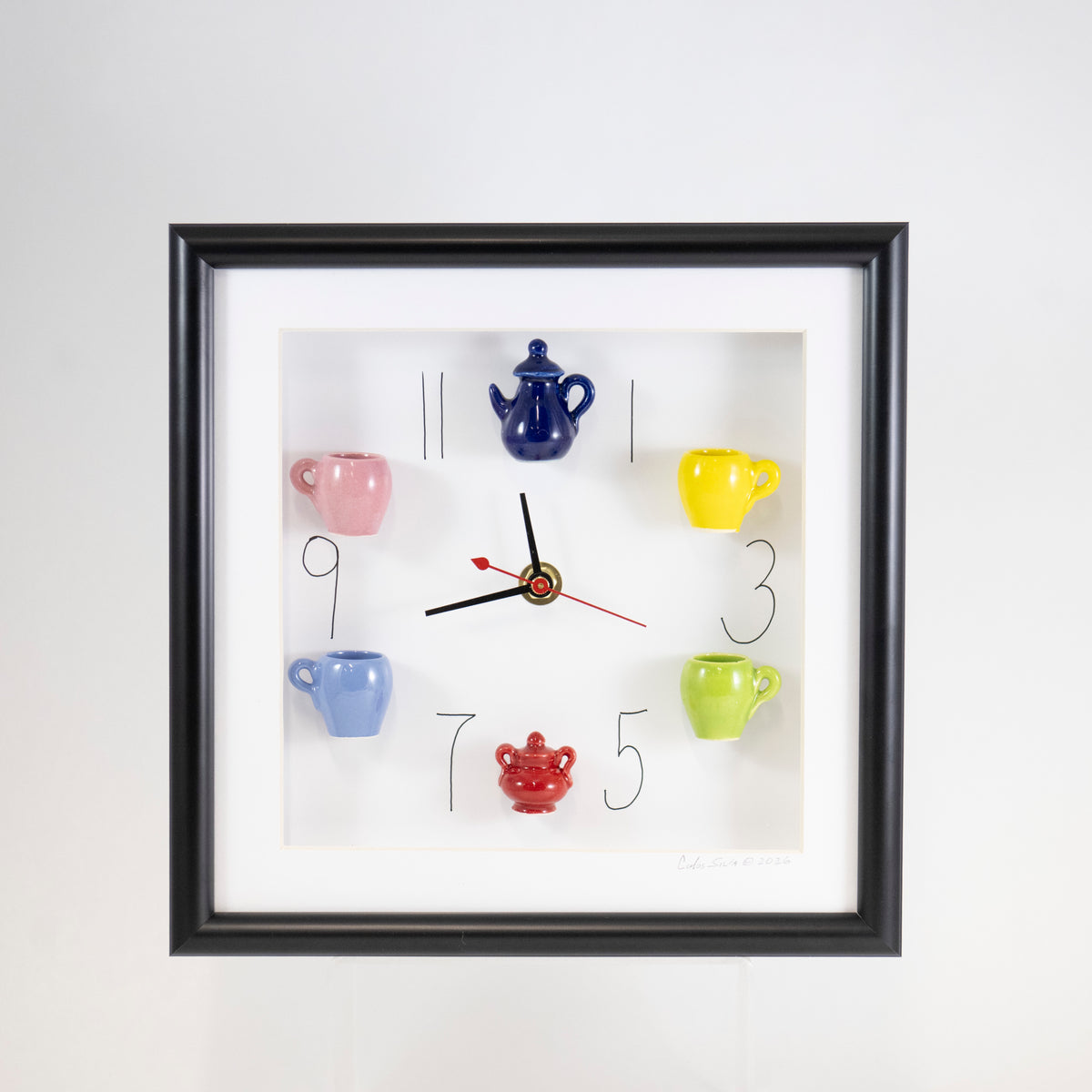 10x10 Clock with a Blue Teapot and Red Sugar Jar in a Black Frame