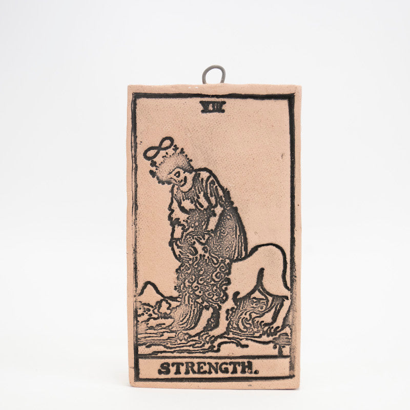 Strength Ceramic Hanging Tarot Card from Mud Wizards at Pinch in Northampton, MA