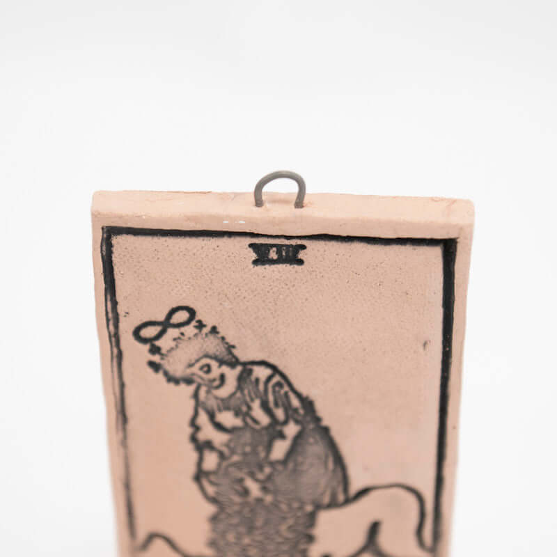 Strength Ceramic Hanging Tarot Card from Mud Wizards at Pinch in Northampton, MA