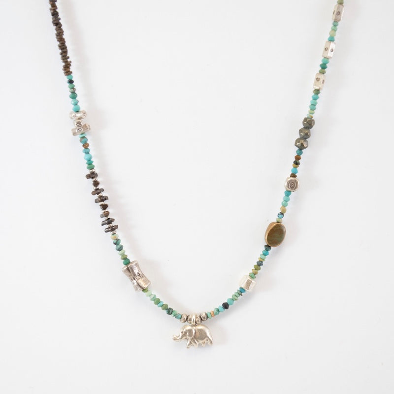 Silver Industrial Turquoise Necklace with Lucky Elephant from Riverstone Jewelry at Pinch in Northampton, MA