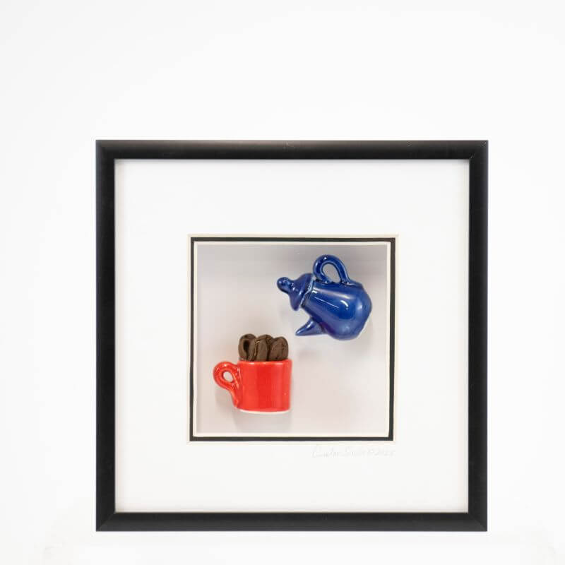 6x6 Shadowbox with a Navy Teapot Pouring into a Red Cup of Coffee Beans in a Black Frame