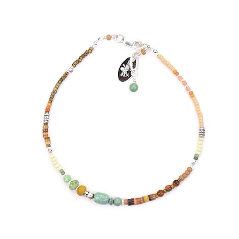 Sterling Silver Bracelet with Turquoise, Shell Heishe, Olive Wood, and Salmon Coral from Chipita at Pinch in Northampton, MA