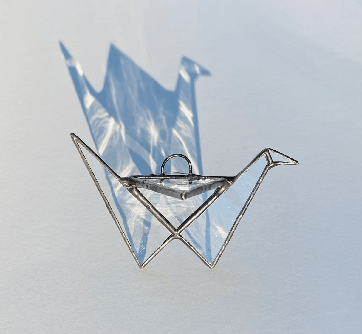 Stained Glass Origami Crane Suncatcher in Clear from Samara Designs Studio at Pinch in Northampton, MA