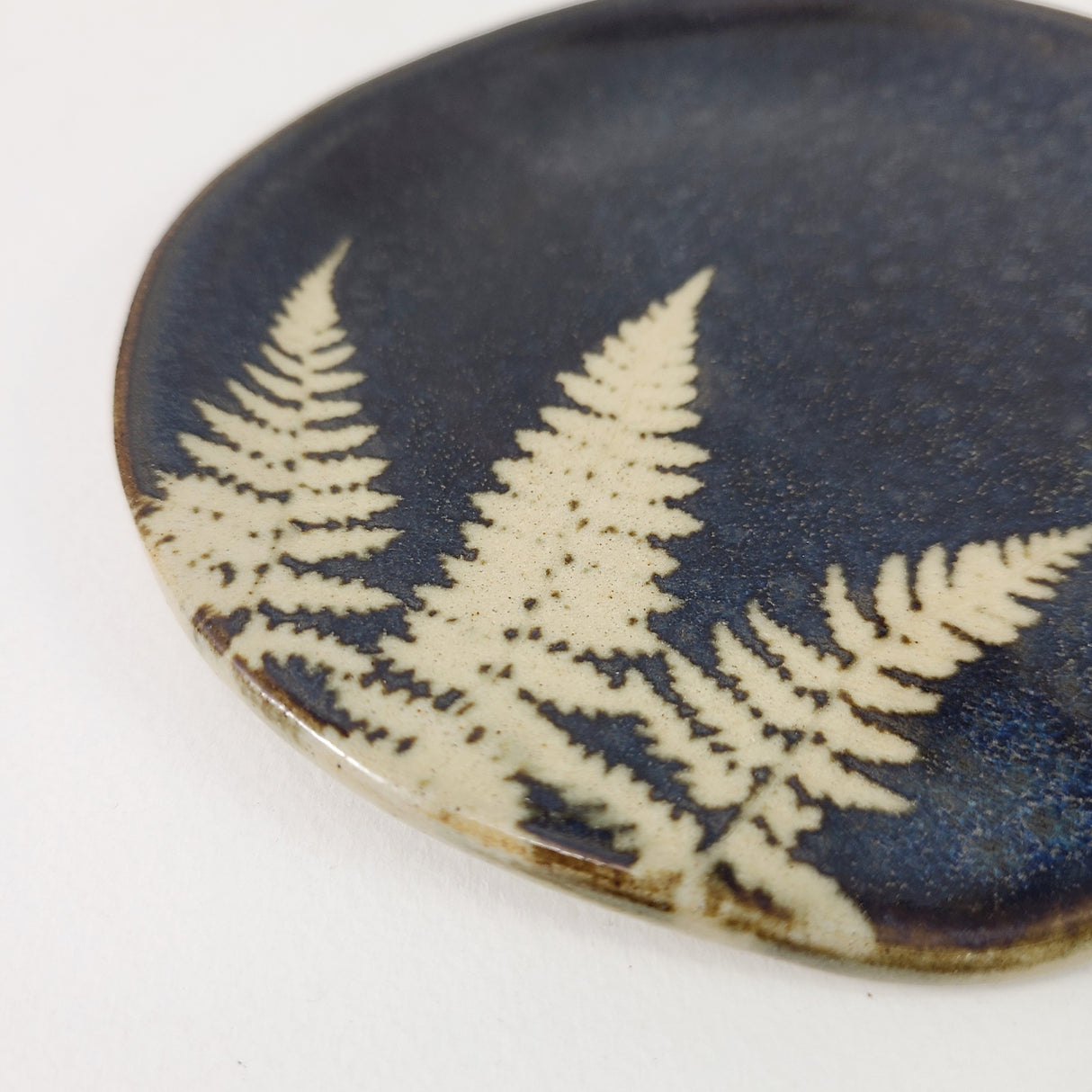 Fern Spoonrest in Dark Blue Glaze from Kaleidoscope Pottery at Pinch in Northampton, MA