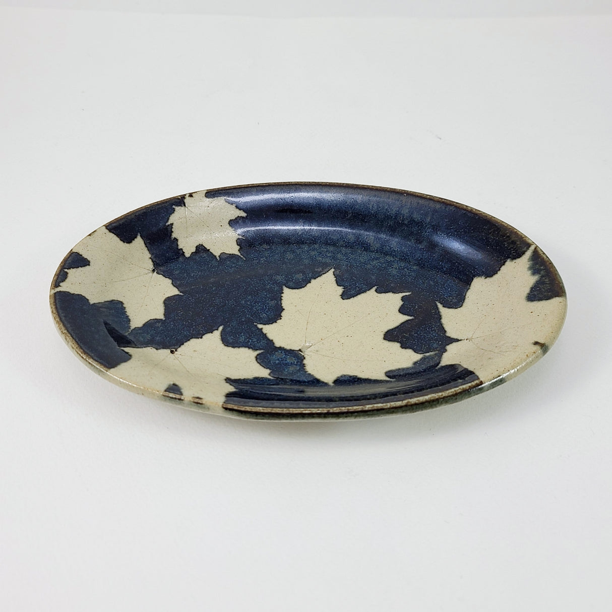 Maple Dark Small Oval Plate from Kaleidoscope Pottery at Pinch in Northampton, MA