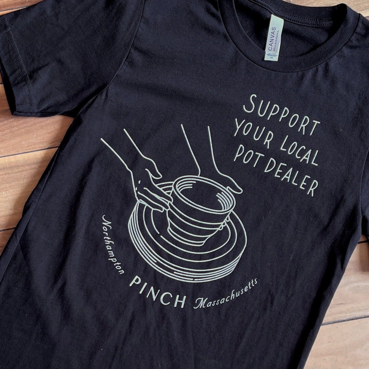 T-Shirt Support Your Local Pot Dealer in Black with White Ink from Pinch at Pinch in Northampton, MA