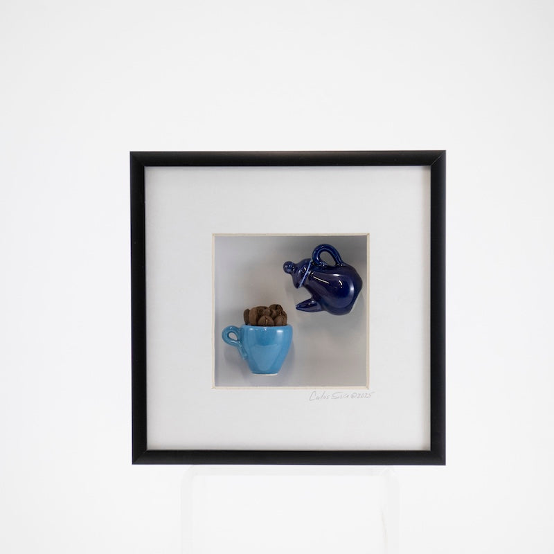 6x6 Shadowbox with a Navy Teapot Pouring into a Blue Coffee Mug in a Black Frame