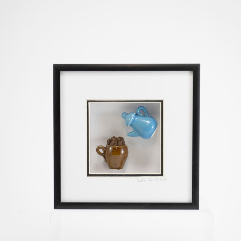 6x6 Shadowbox with a Blue Teapot, Brown Mug, and Coffee Beans in a Black Frame