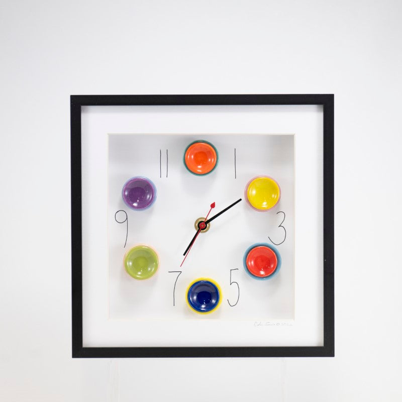 10x10 Clock with Orange and Green Plates in a Black Frame