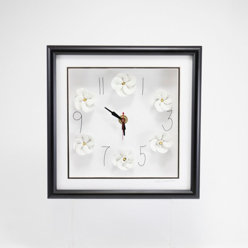 10x10 Clock With White Flowers and Short Hands in a Black Frame