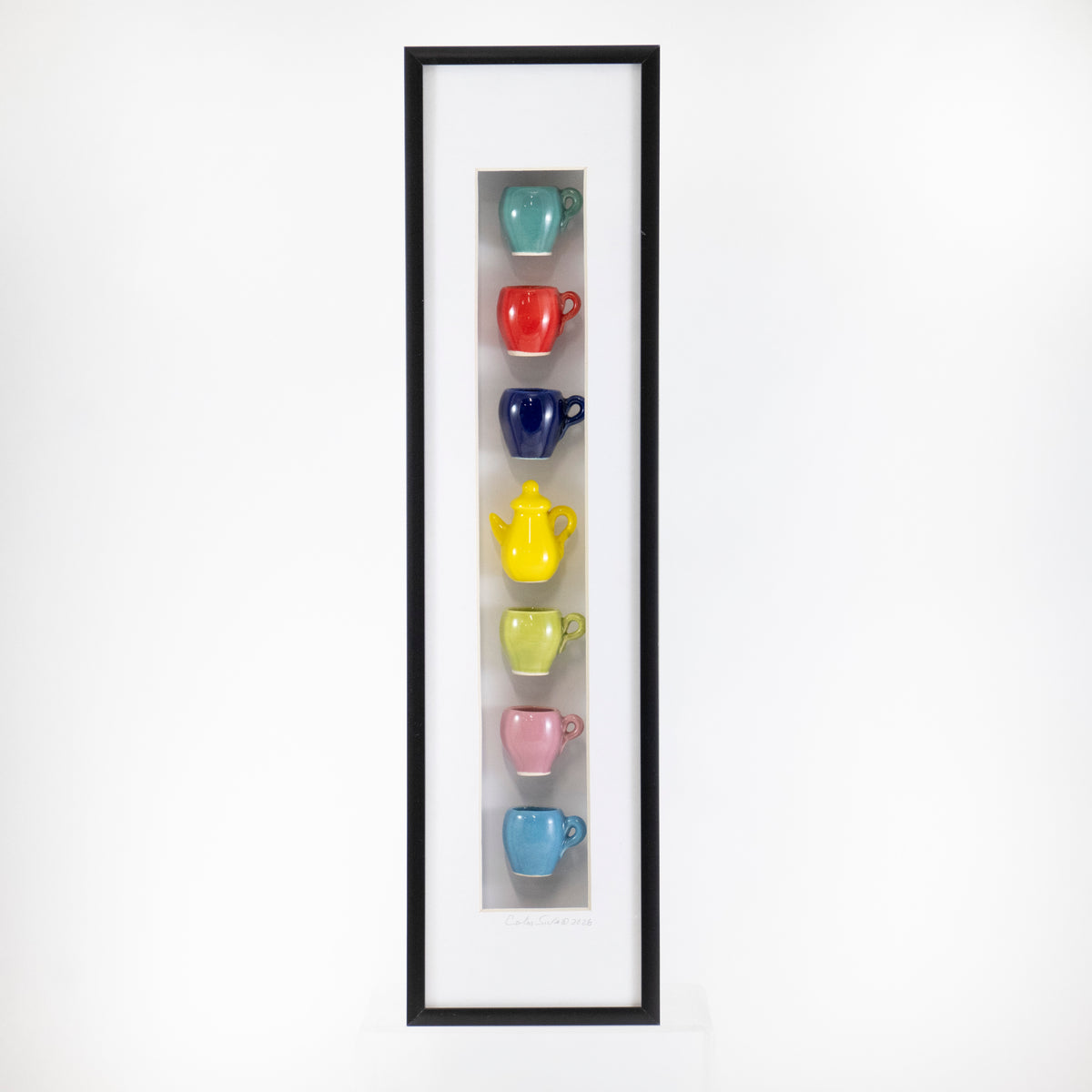 4x16 Vertical Shadowbox with a Dark Blue Mug and Yellow Teapot in a Black Frame