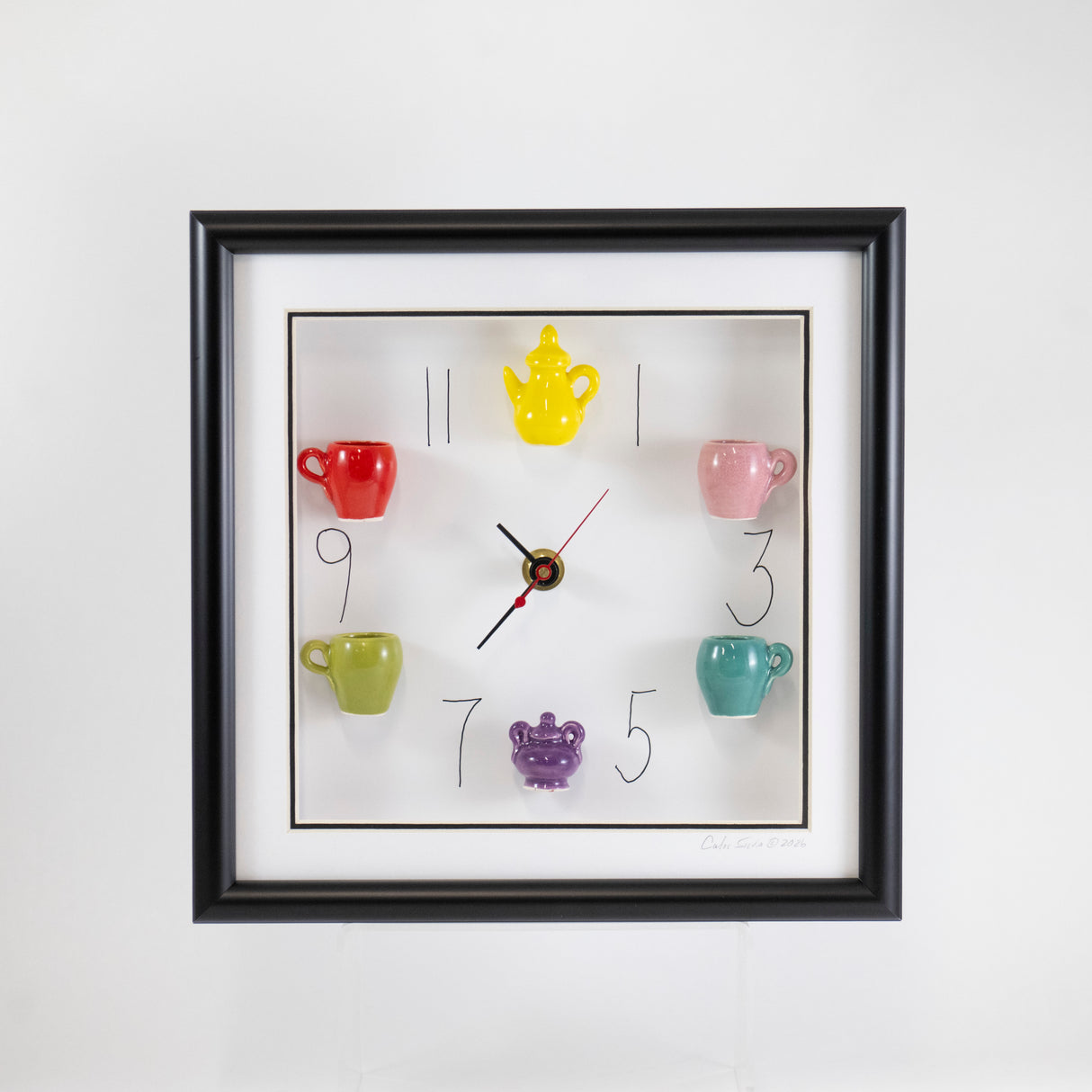 10x 10 Clock with a Yellow Teapot and Purple Sugar Jar in a Black Frame