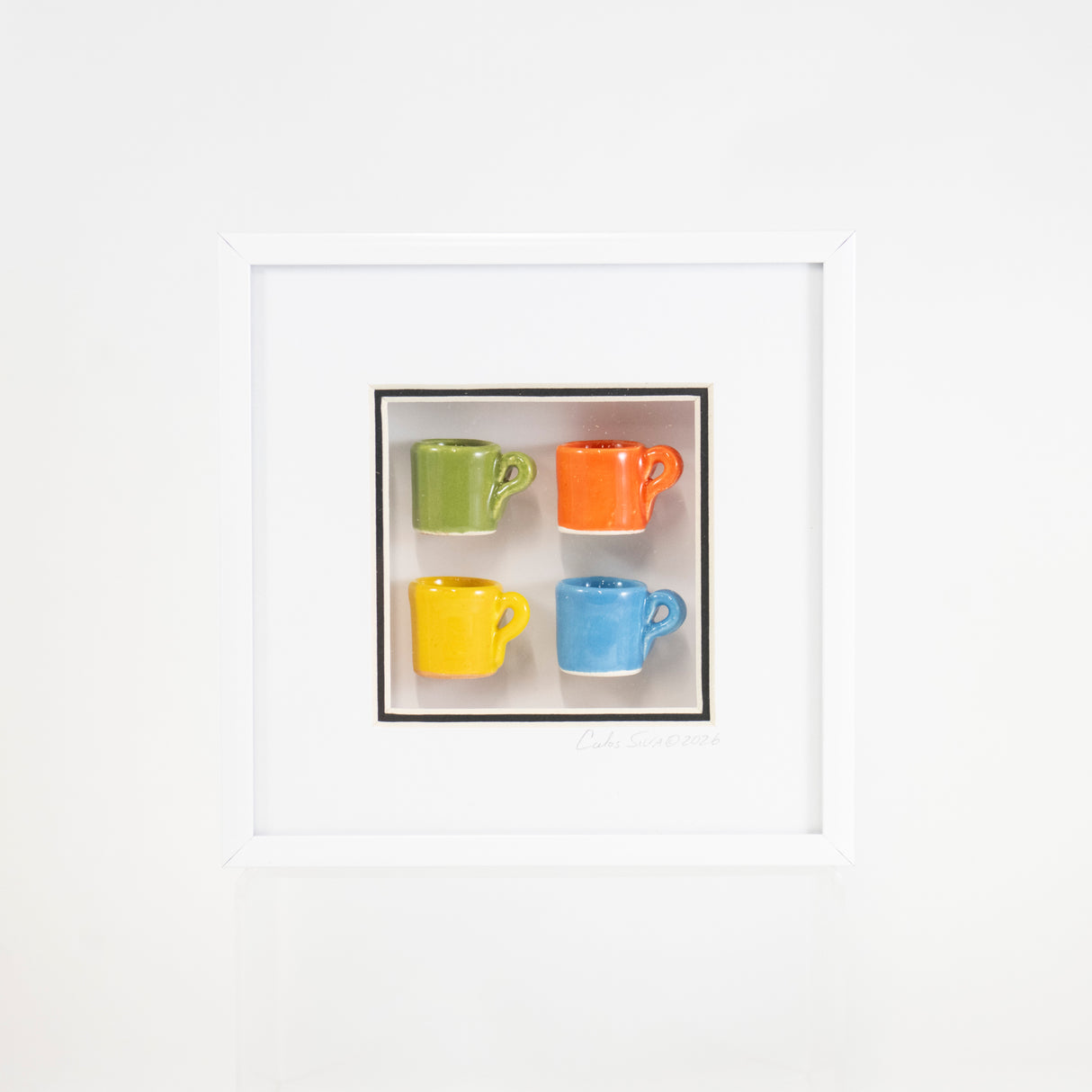 6x6 Shadowbox with Green and Blue Mugs in a White Frame