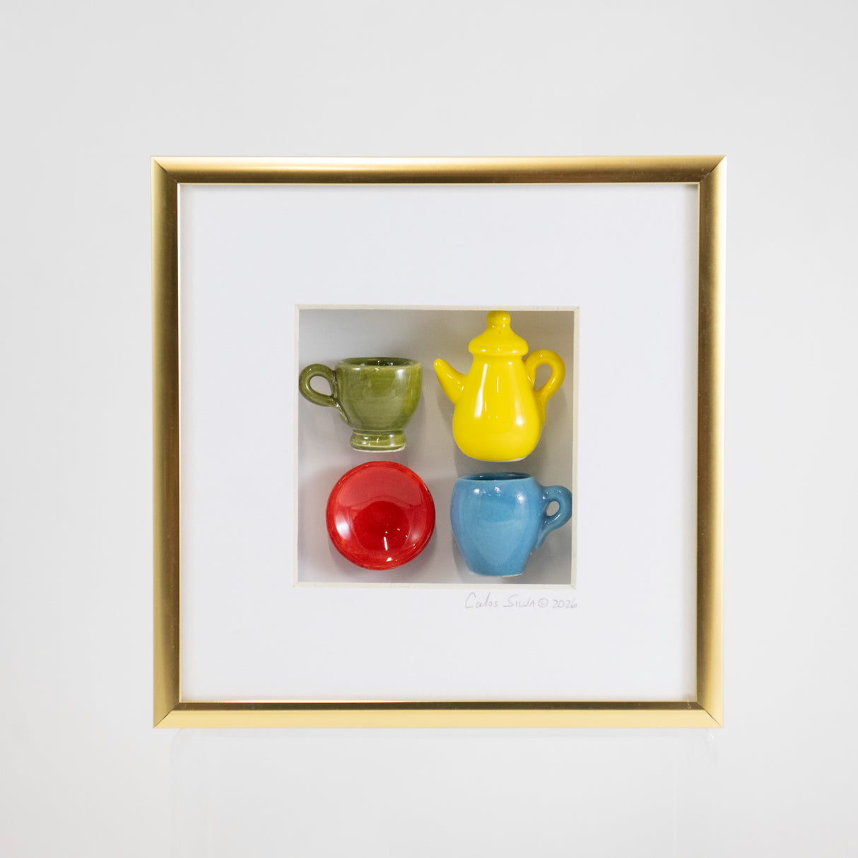 6x6 Shadowbox with a Yellow Teapot and Red Plate in a Gold Frame
