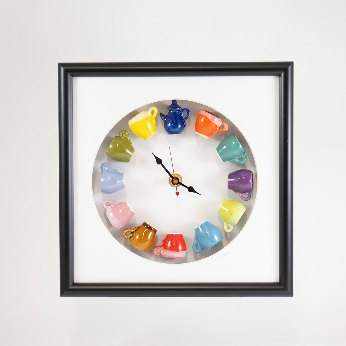 10x10 Clock with a Blue Teapot and Red Mug in a Rounded Matte and Black Frame