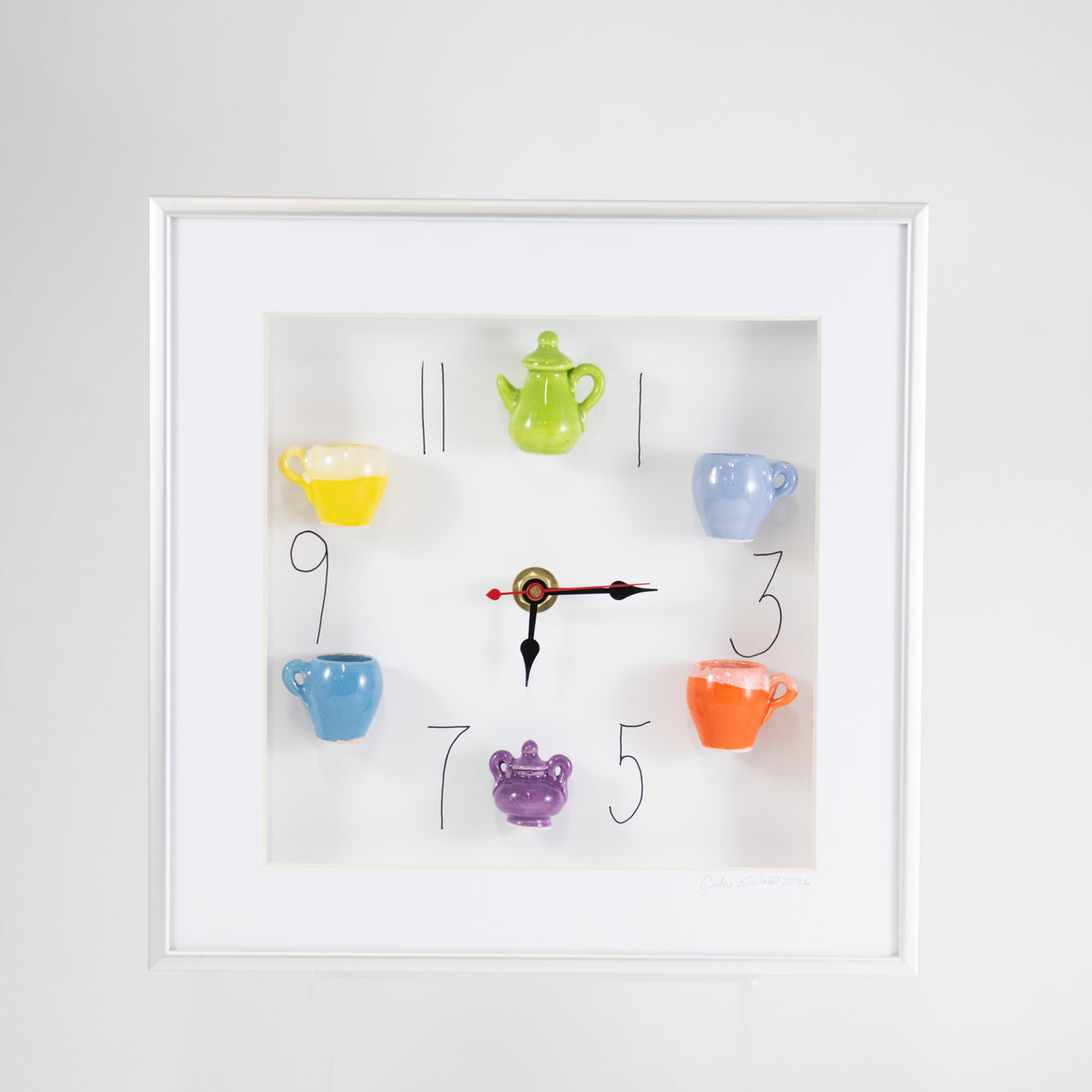 10x10 Clock with a Green Teapot and Purple Sugar Jar in a White Frame