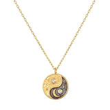 Black & Gold Yin Yang Necklace from Satya at Pinch in Northampton, MA