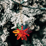 Rainbow Snowflake Quilled Ornament from Ten Thousand Villages at Pinch in Northampton, MA